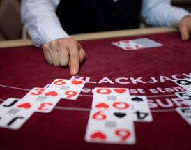 6 to 5 Blackjack: A player is considering her options