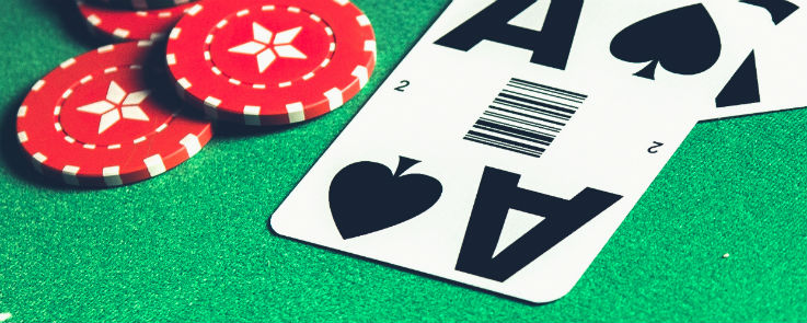 Ace of Spades on a blackjack table with casino chips