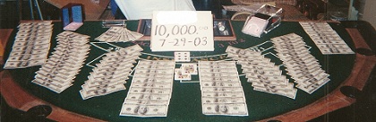 A picture of Casino table covered with Dollar bills and cards -- 10,000 7-29-03 AP