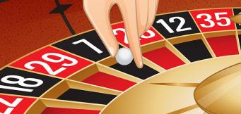 Roulette Croupier holding the roulette ball